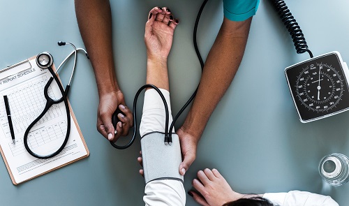 Nurse taking vitals of a patient