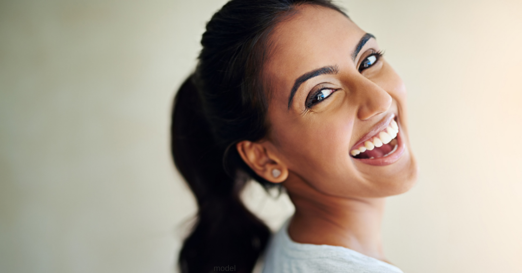 Woman smiling when discussing facelift options